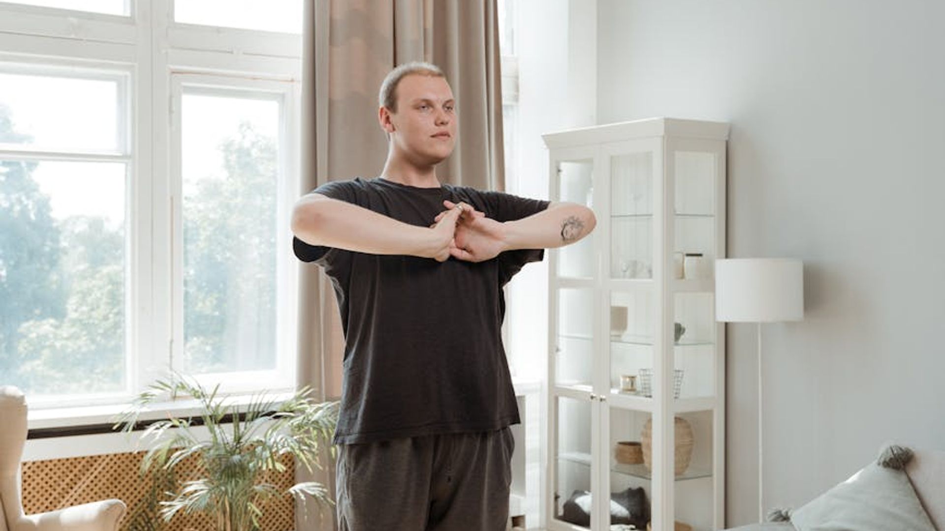 Person doing rhythmic exercises in a bright sunlit room